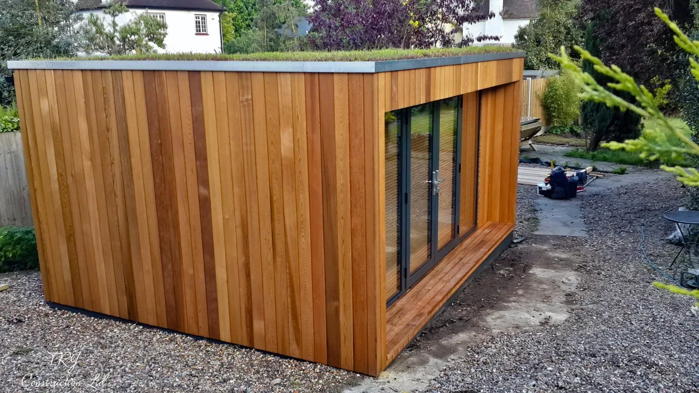 Red cedar garden room constructed with SIP panels, showcasing a modern and sustainable design