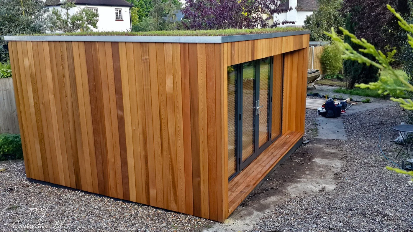 Red cedar garden room constructed with SIP panels, showcasing a modern and sustainable design