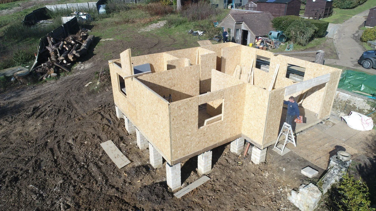 Structural Insulated Panel walls being assembled on a TRJ build