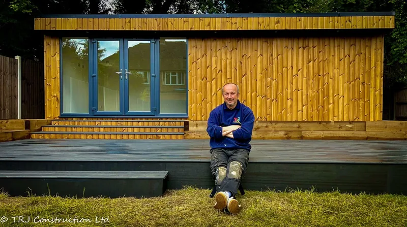 Composite decking outside a completed garden building