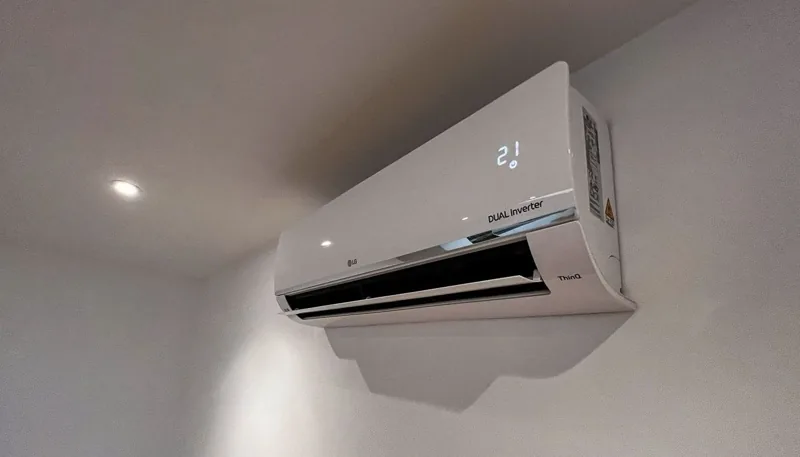 Wall-mounted air conditioning unit inside a garden room