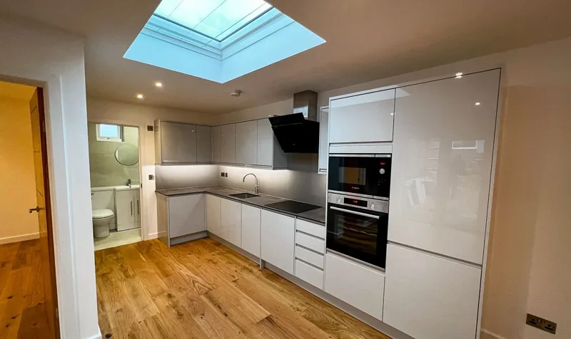Fitted annexe kitchen with cabinetry and appliances