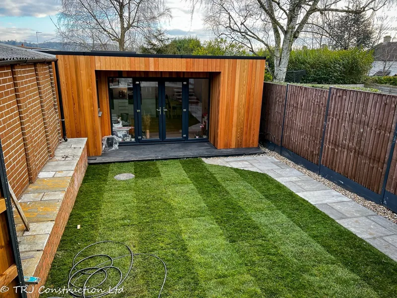 Garden building with full-height French doors and glazing
