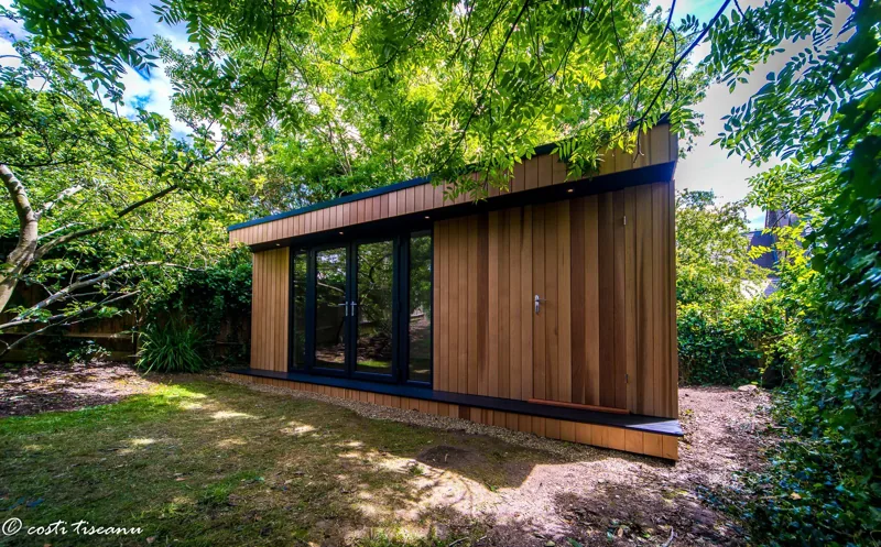 Completed garden room among established trees