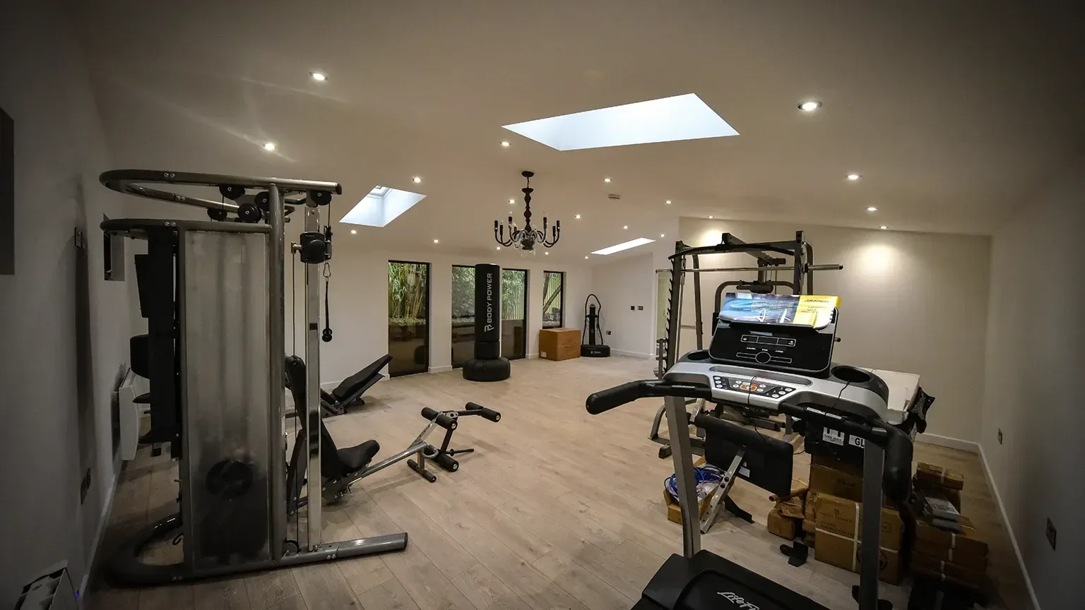 TRJ garden gym interior with exercise equipment and a rooflight