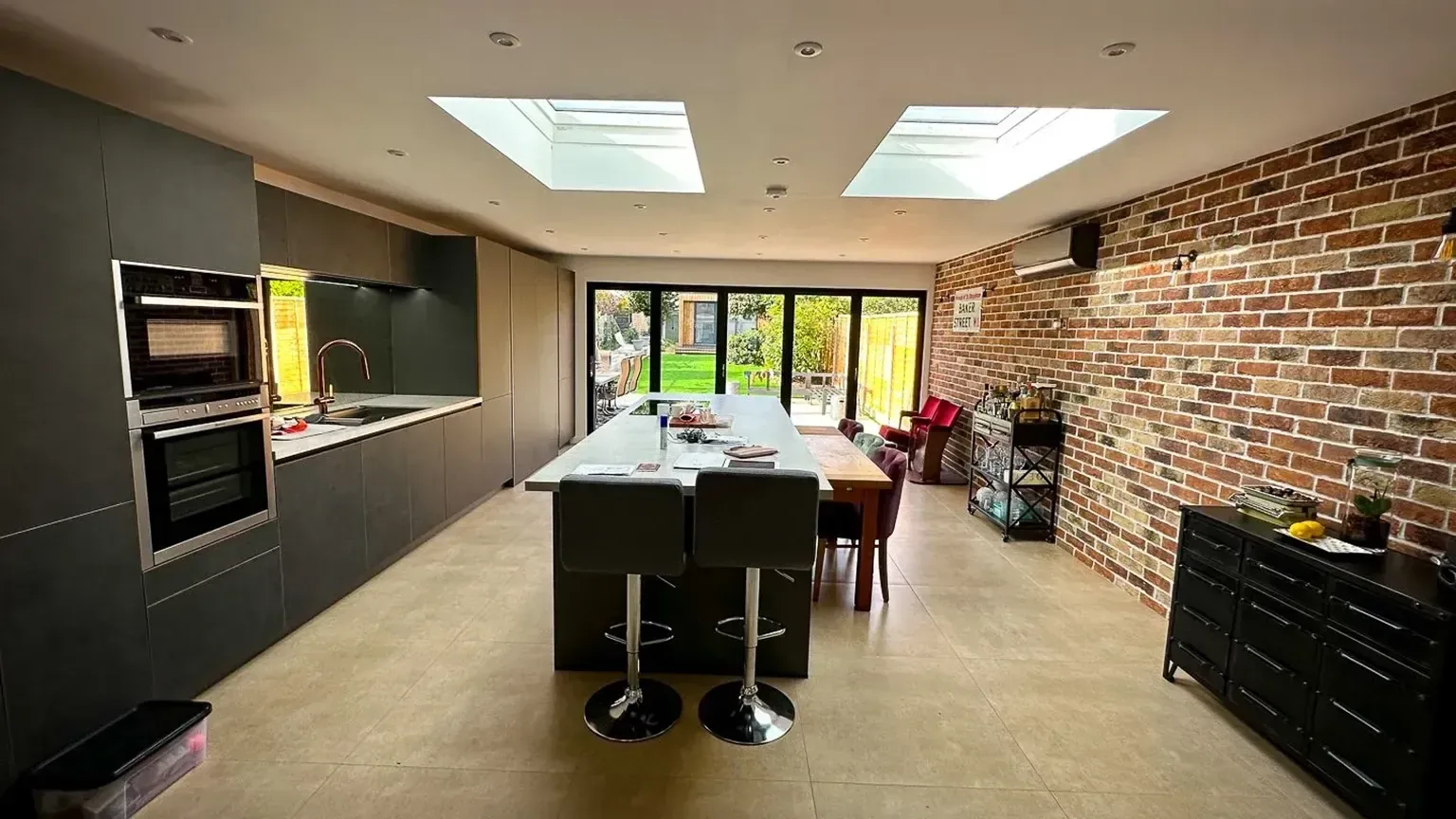 TRJ kitchen interior with an island and garden-facing glazing