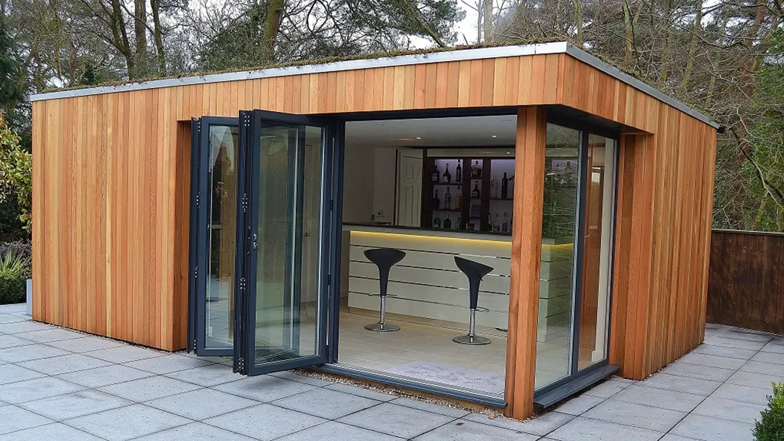 Timber-clad TRJ garden retreat with folding doors