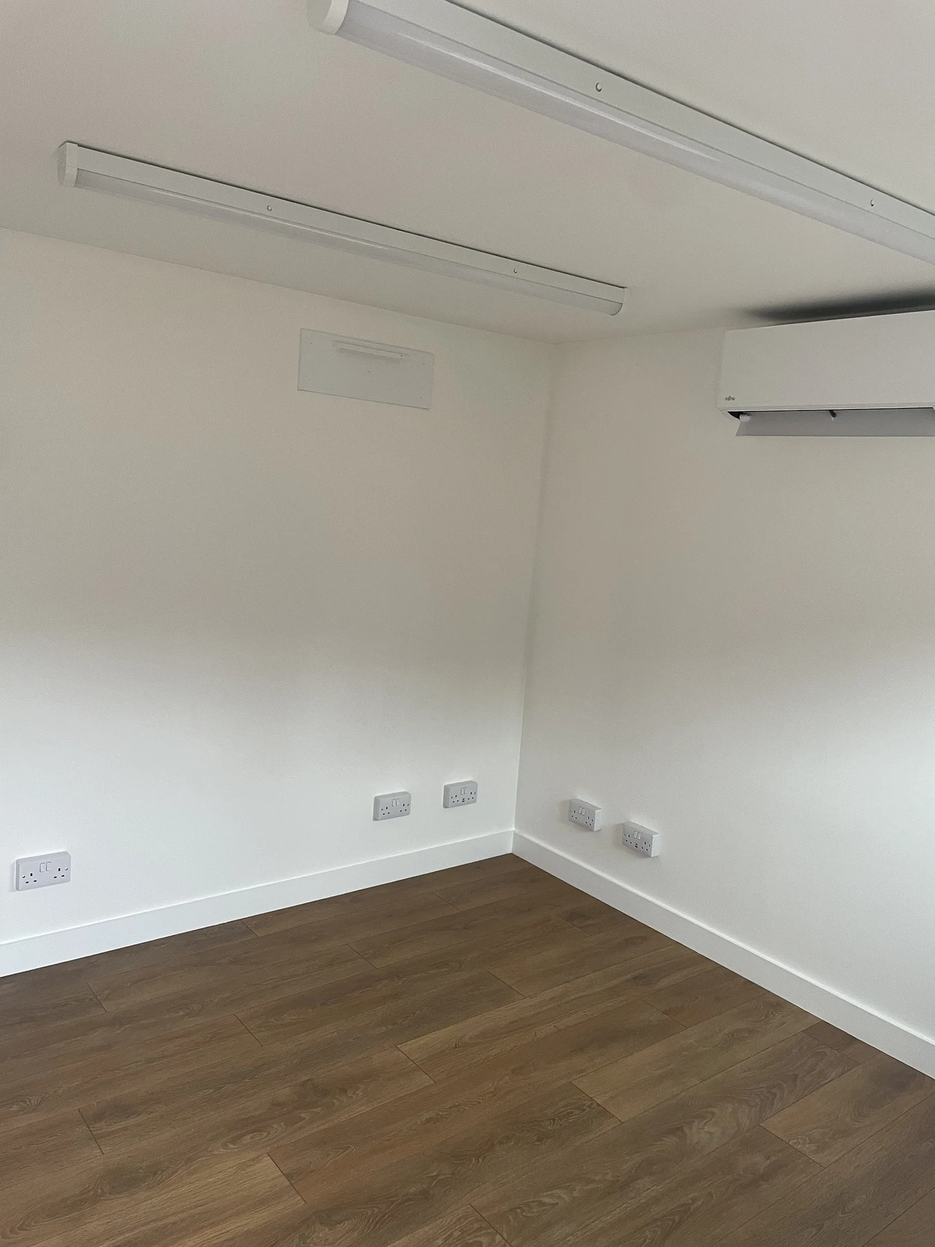 Finished Chesham studio interior with lighting and wall-mounted climate control