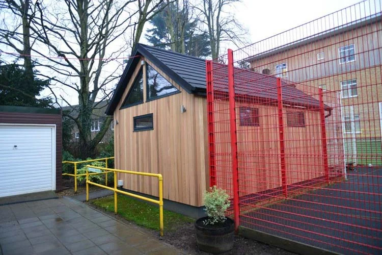 Side elevation and school fencing — Wimbledon Park, London