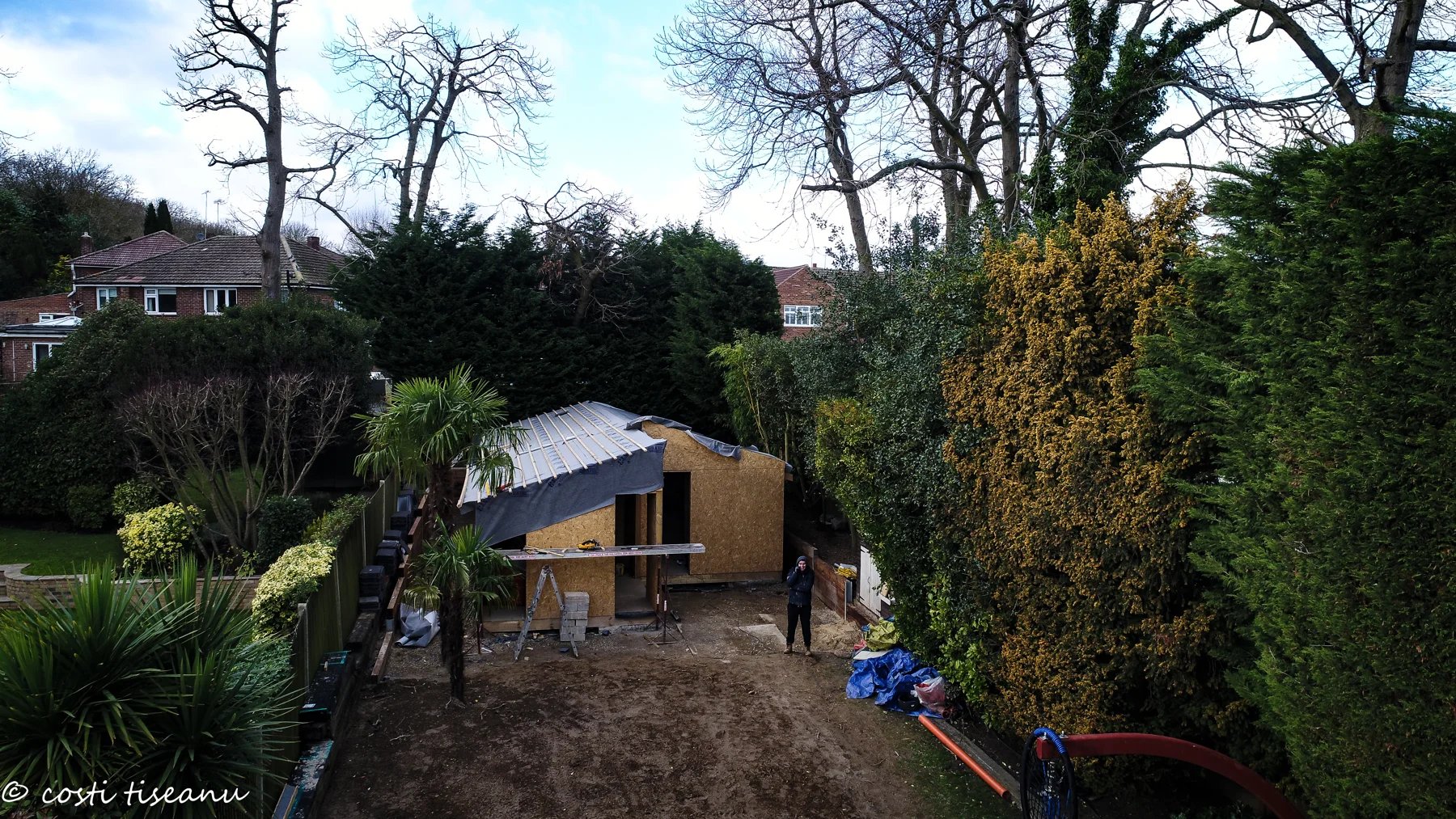 The garden building during construction, showing the pitched roof and garden setting