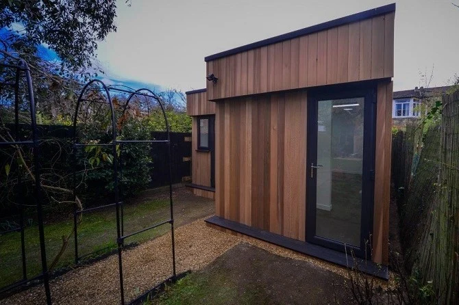 Timber-clad art studio with French doors in Crouch End