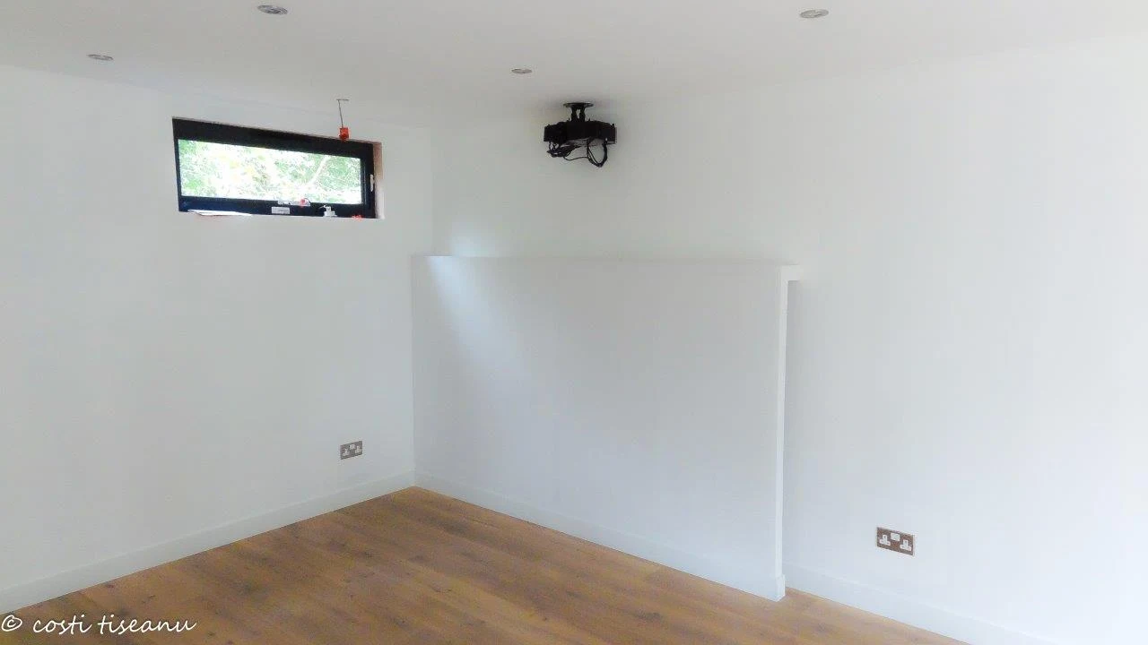 Farnham games-room interior with oak flooring and table-tennis topper storage