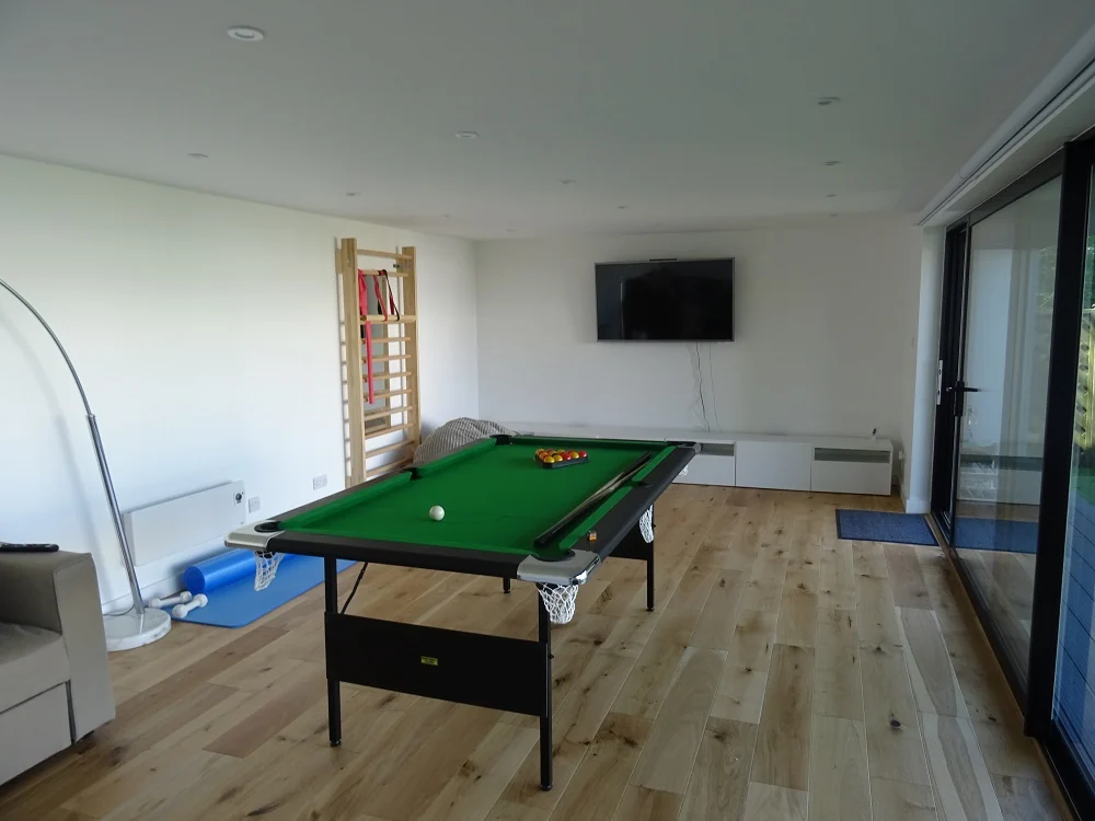 Pool table and garden-facing sliding doors — Beckenham, London