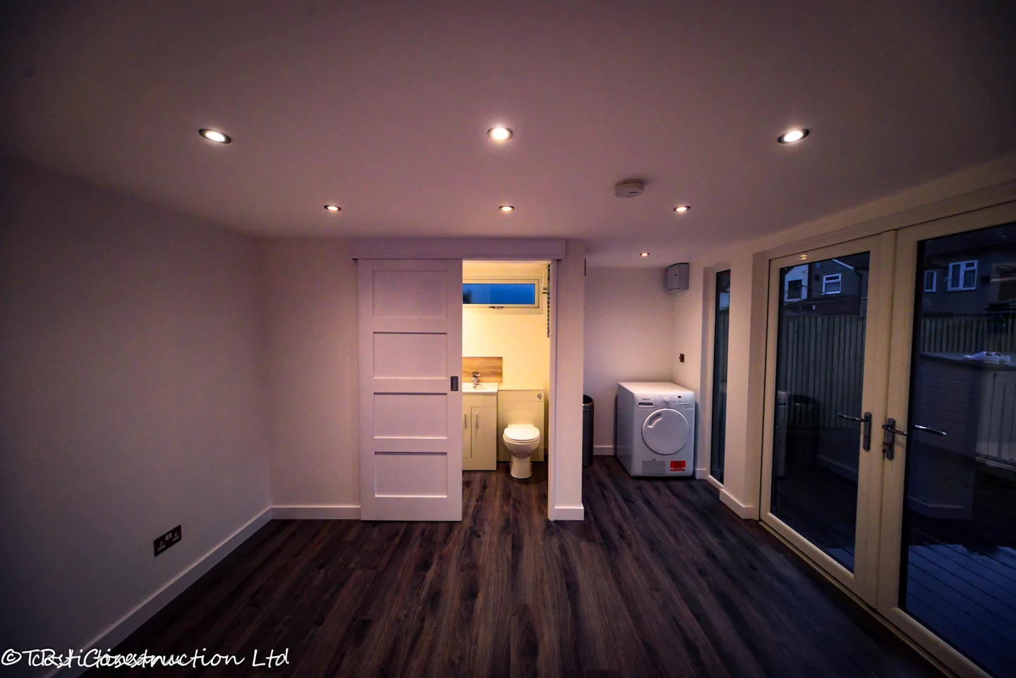 Sliding bathroom door and glazed frontage inside the Havering studio