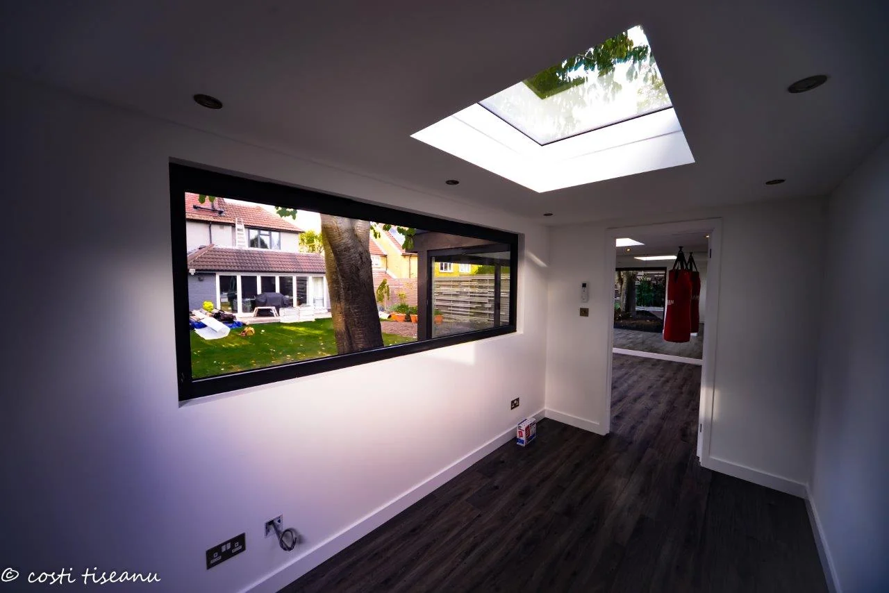 Interior with rooflight and wall sockets — Putney, London