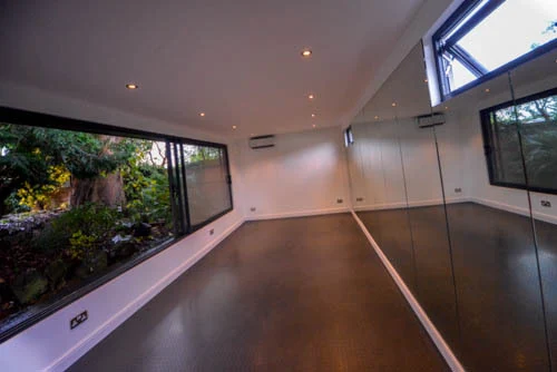 Mirrored walls and rubber flooring inside the Haringey garden gym