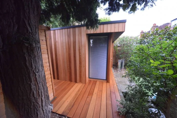 Gym and adjoining hardwood deck — Ealing, London