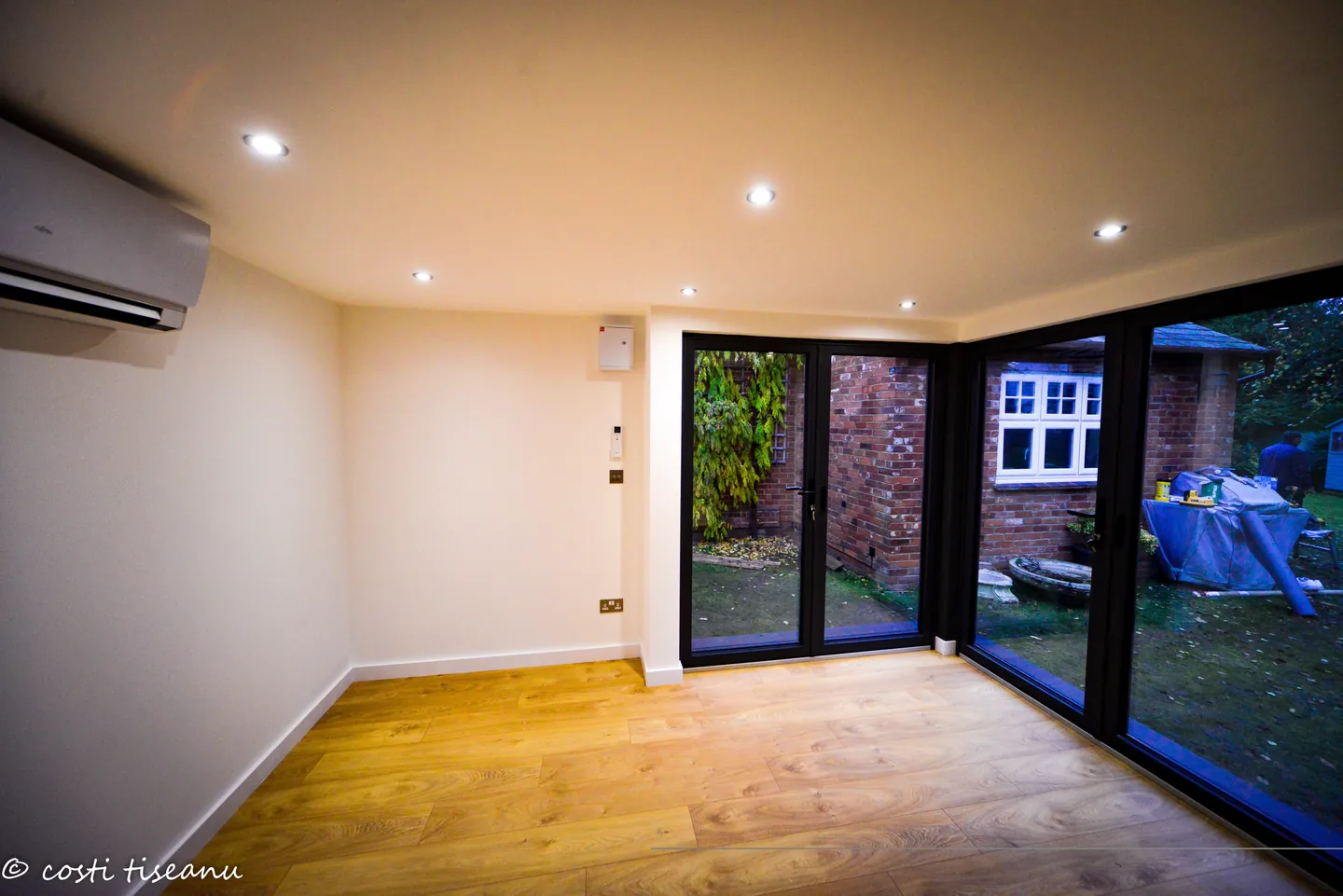 Music studio interior with corner glazing, recessed lights and climate control