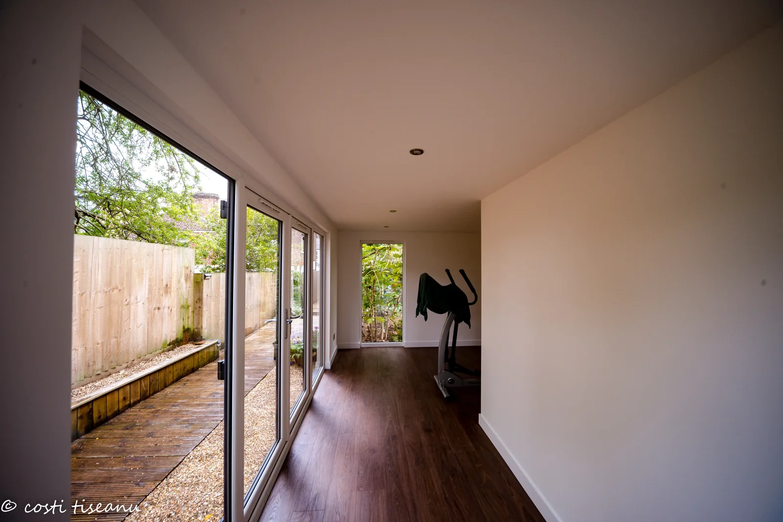 Finished main room with white walls and timber-look flooring
