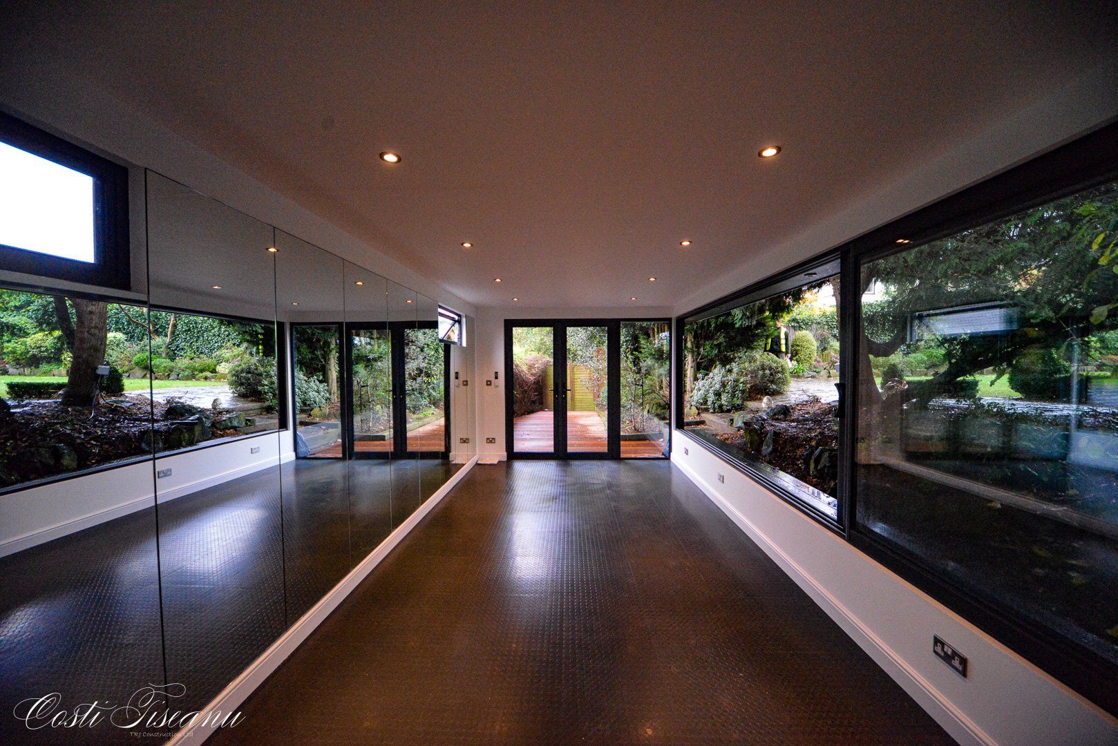 Garden training studio with open floor space and glazed doors