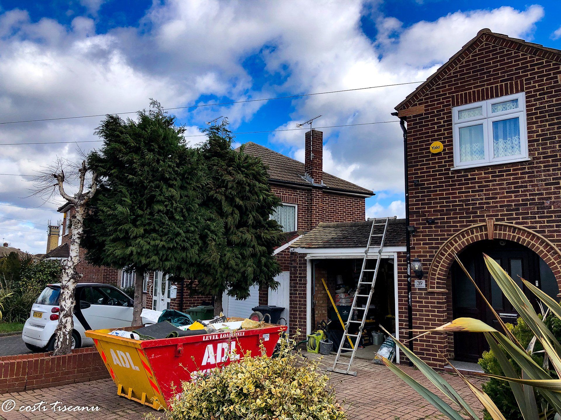 Side extension construction beside an existing brick house