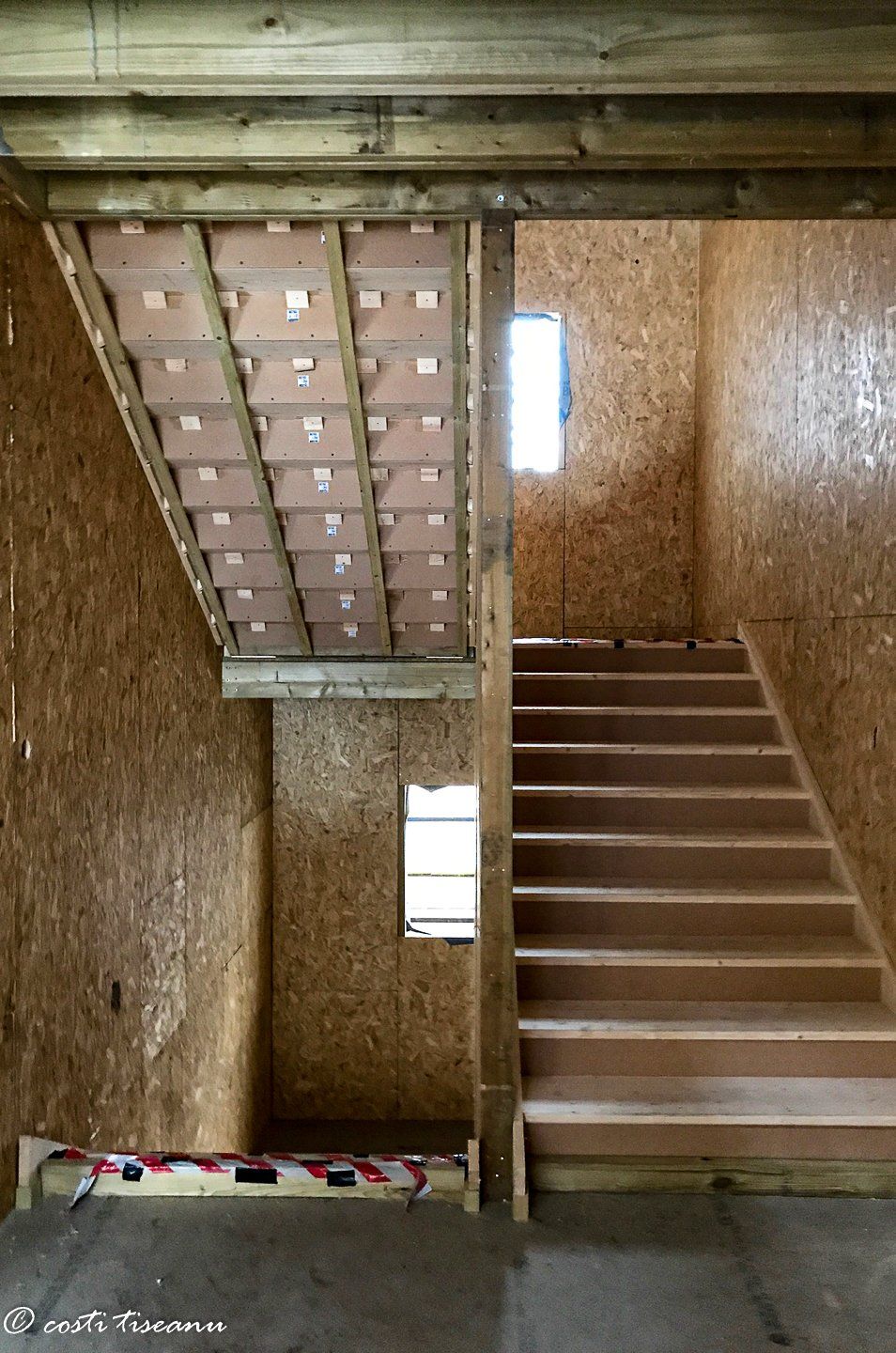 Internal staircase and panel-lined walls during construction