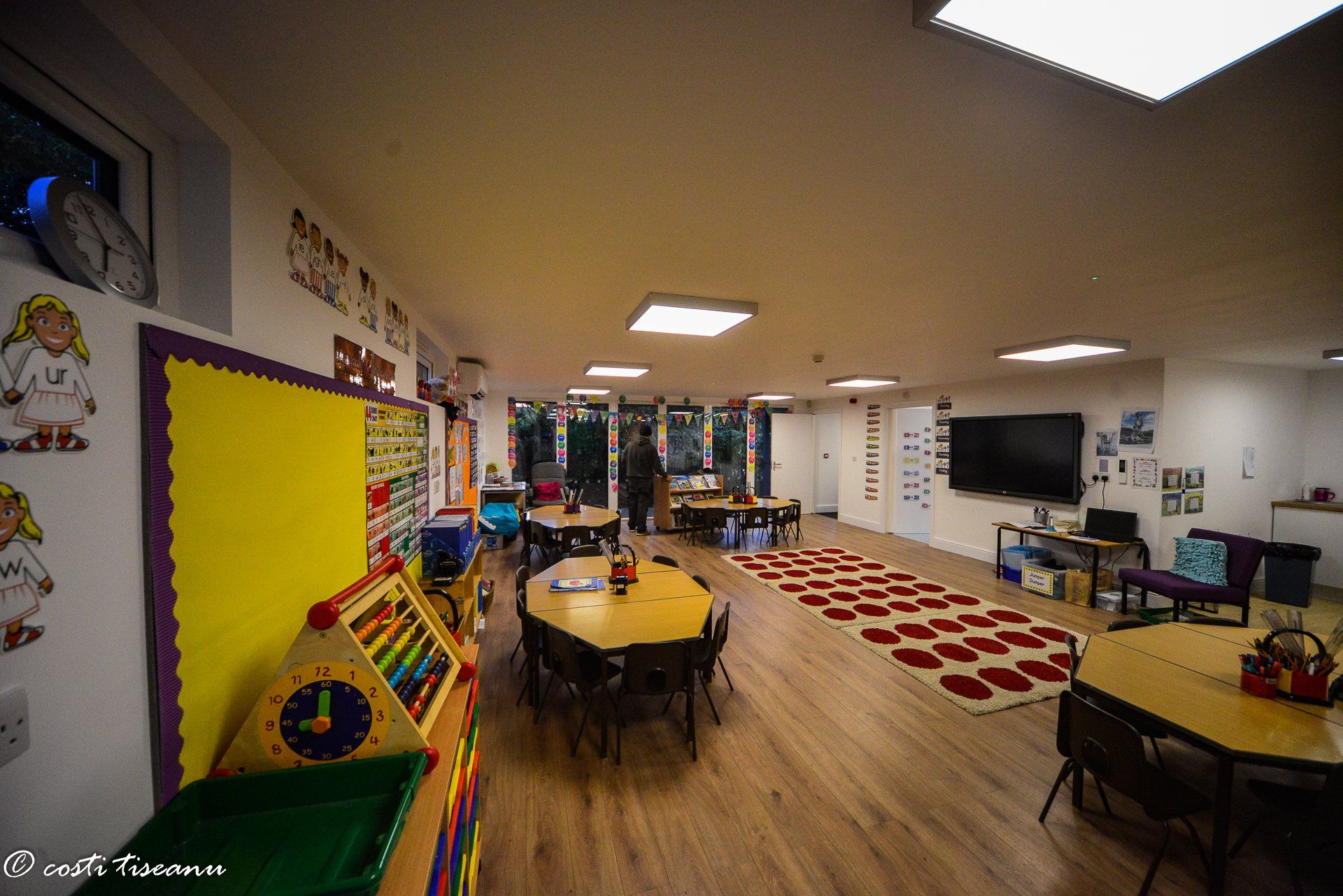 Furnished classroom with tables and learning materials