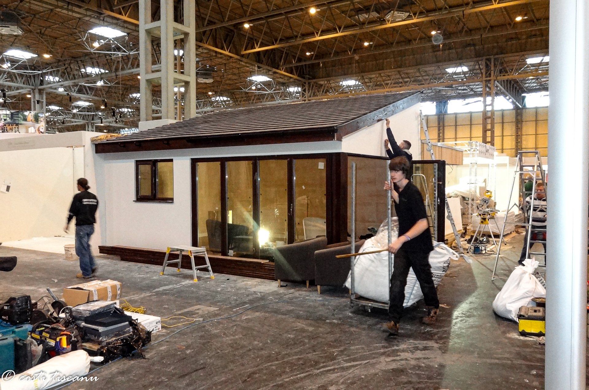 Garden building during installation in the exhibition hall