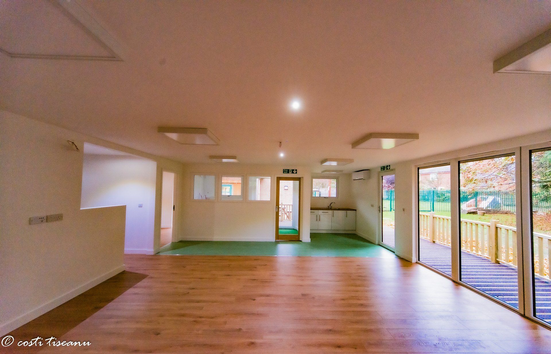 Finished classroom interior with wide glazing and timber-look flooring