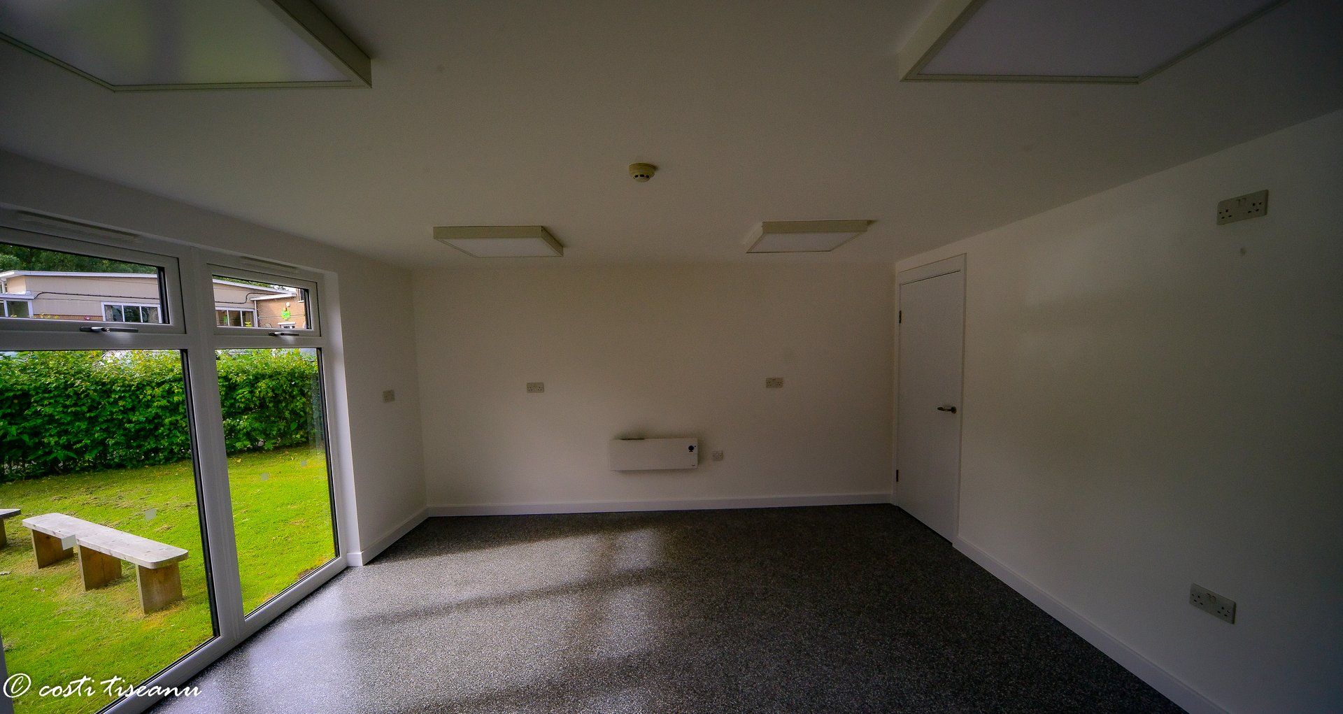 Empty school-room interior with glazed garden doors