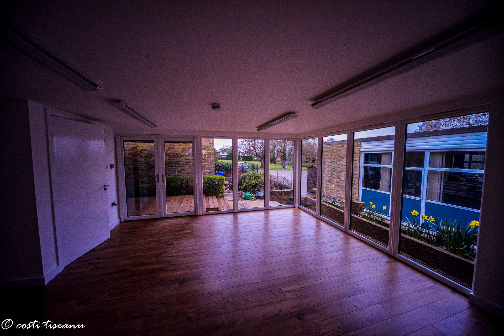Open school-room interior with wide windows