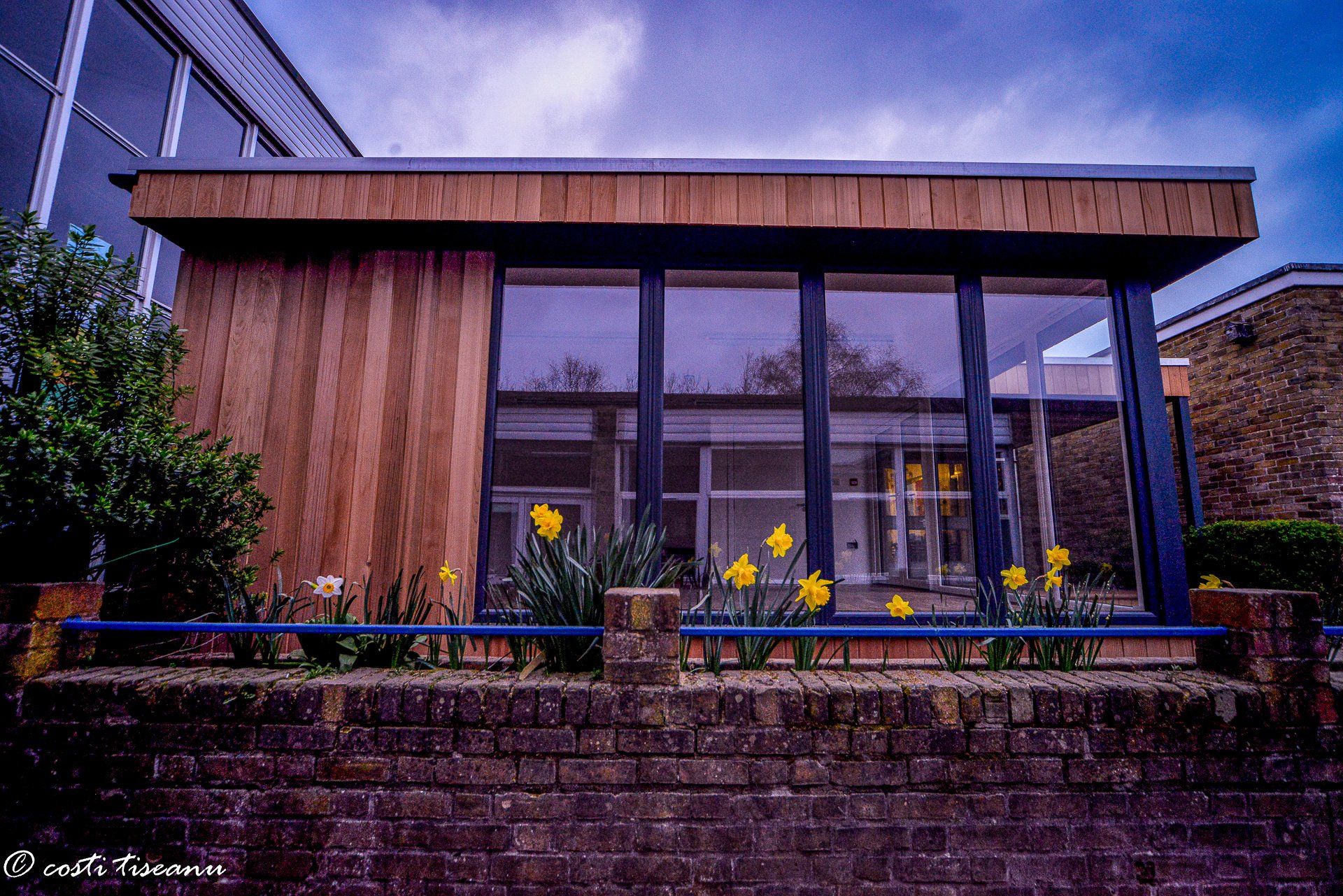Glazed entrance to a timber-clad school building