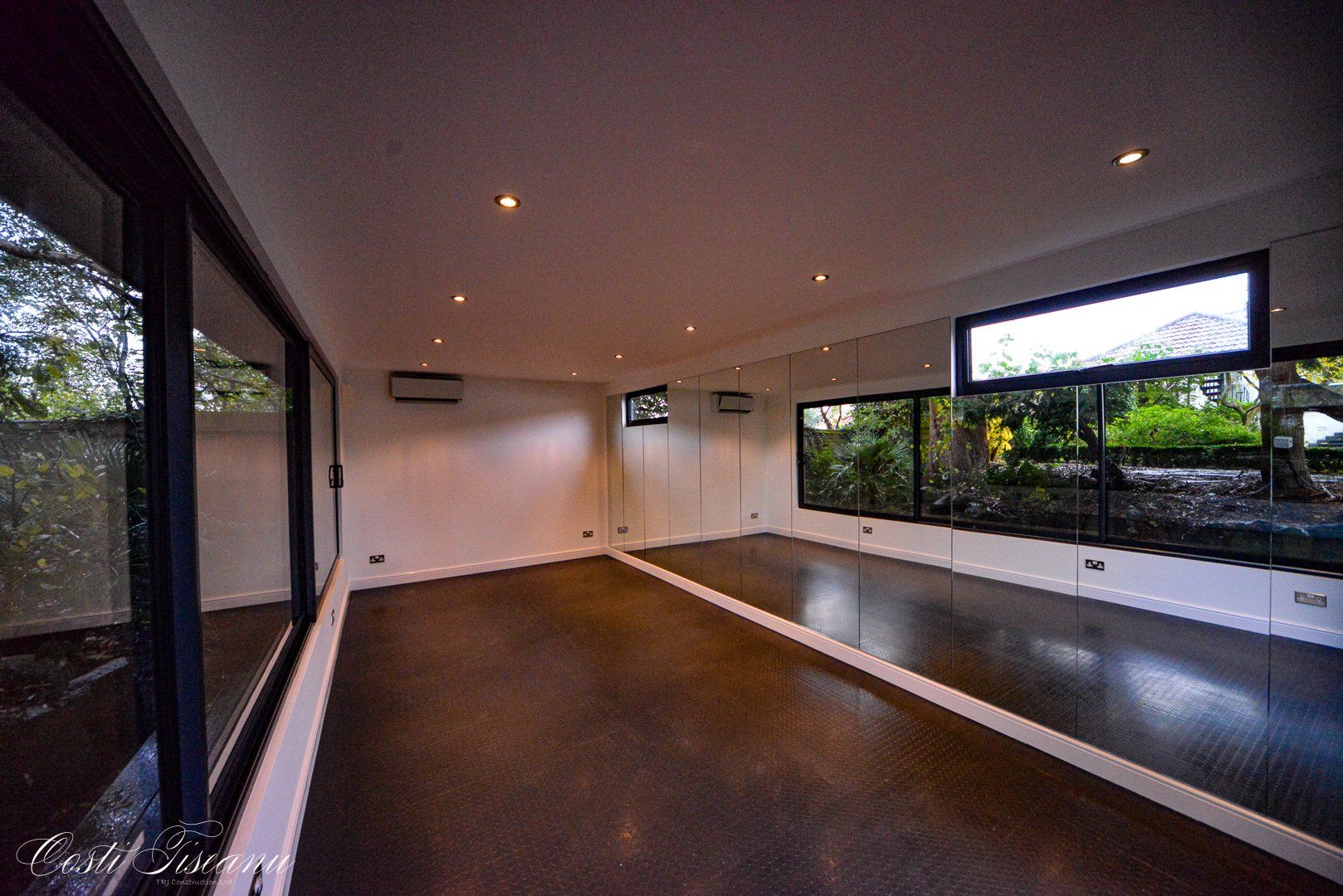 Open fitness studio with garden-facing windows