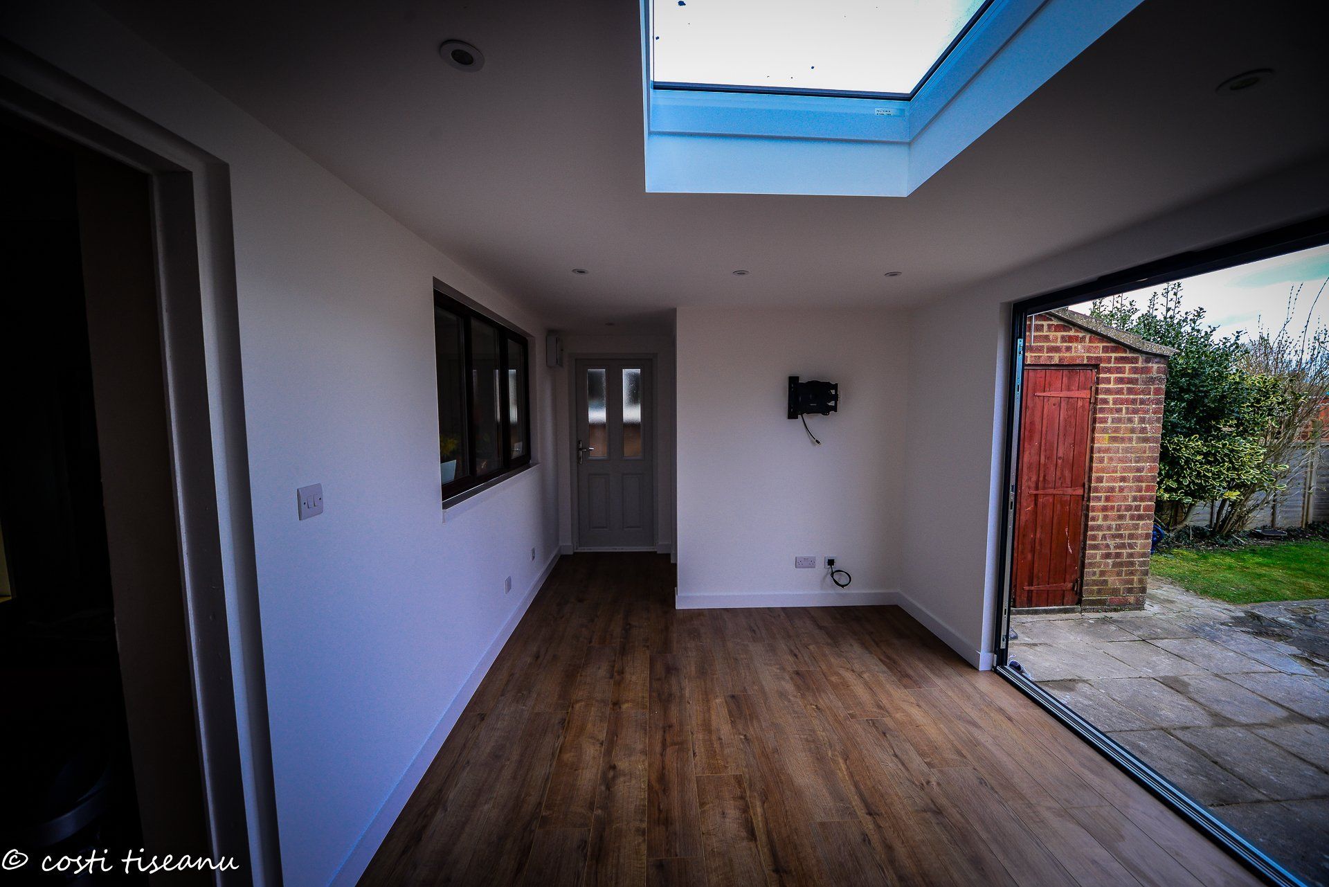 Open-plan extension interior with rooflight and garden glazing