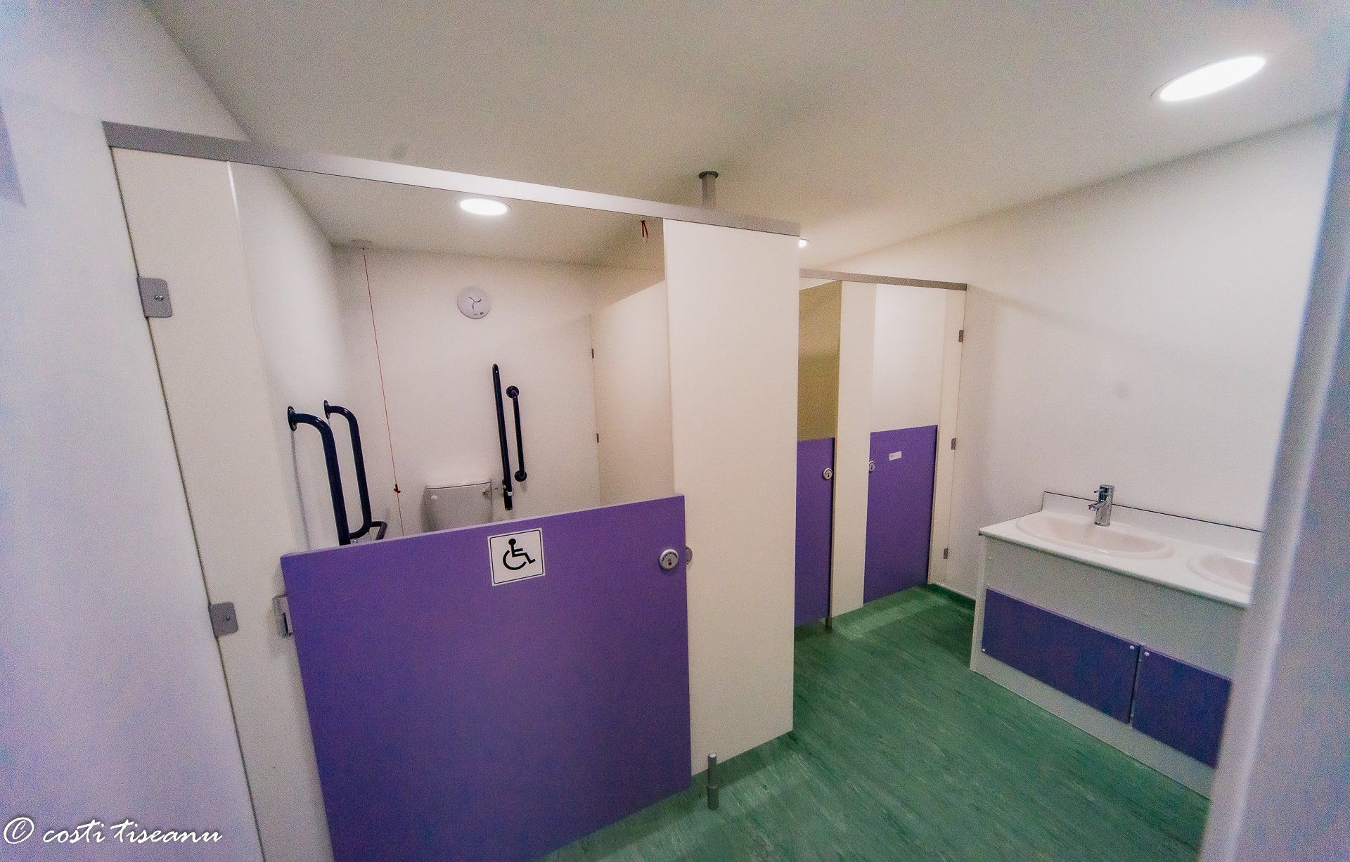 School-building toilet facilities with contrasting purple fittings