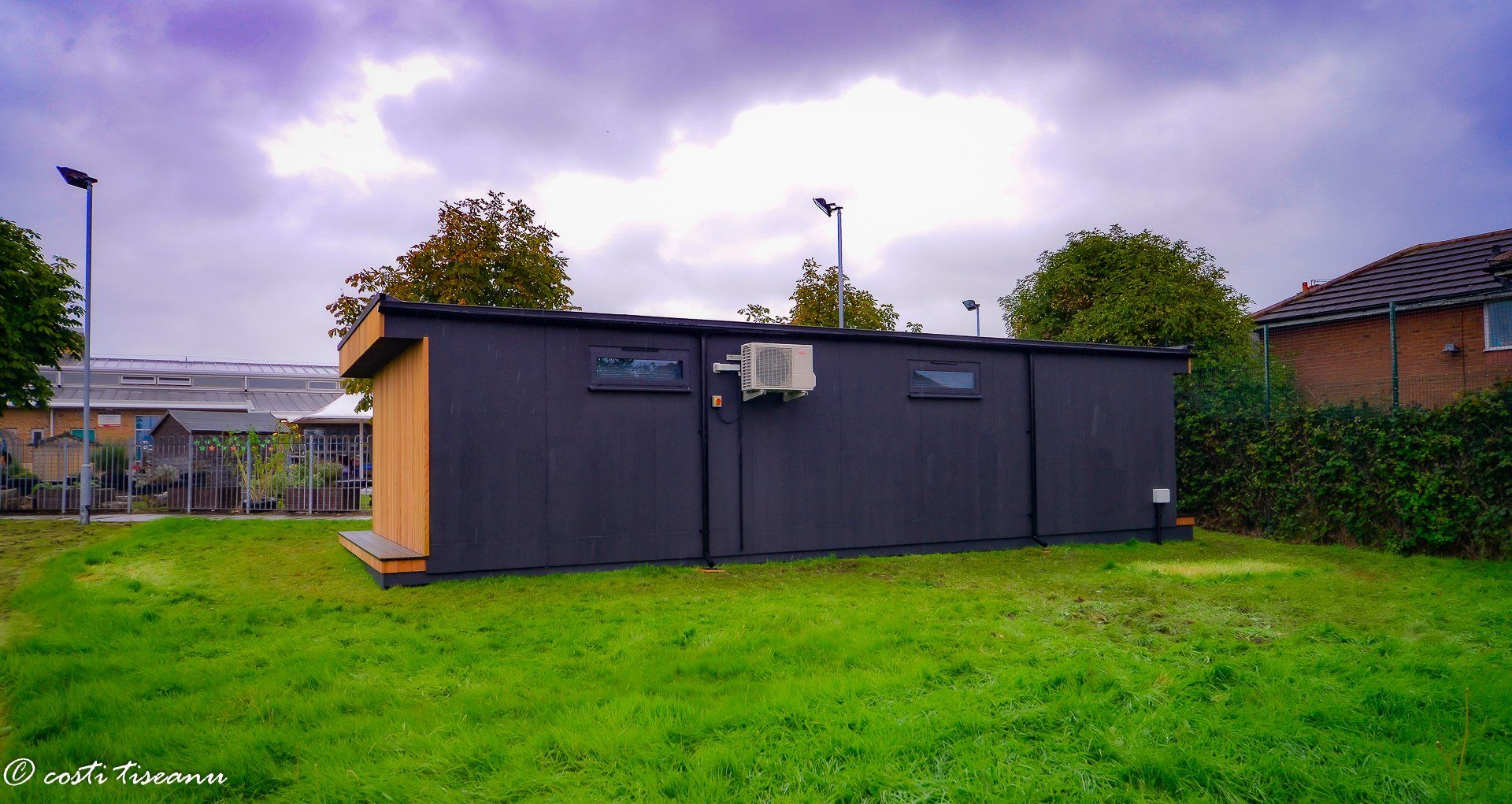 Dark-clad side elevation of a school building