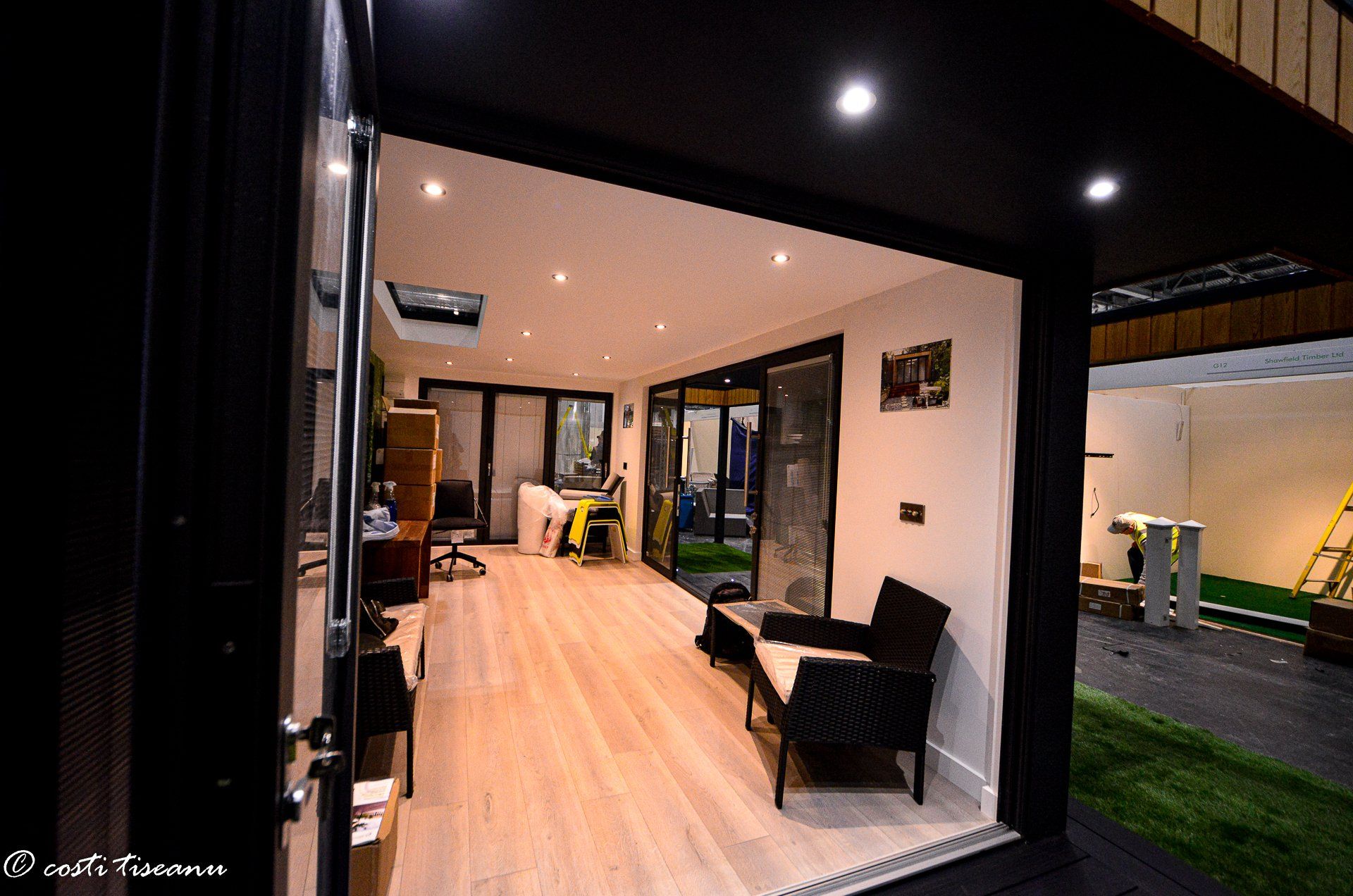 Open exhibition-room entrance with interior downlights