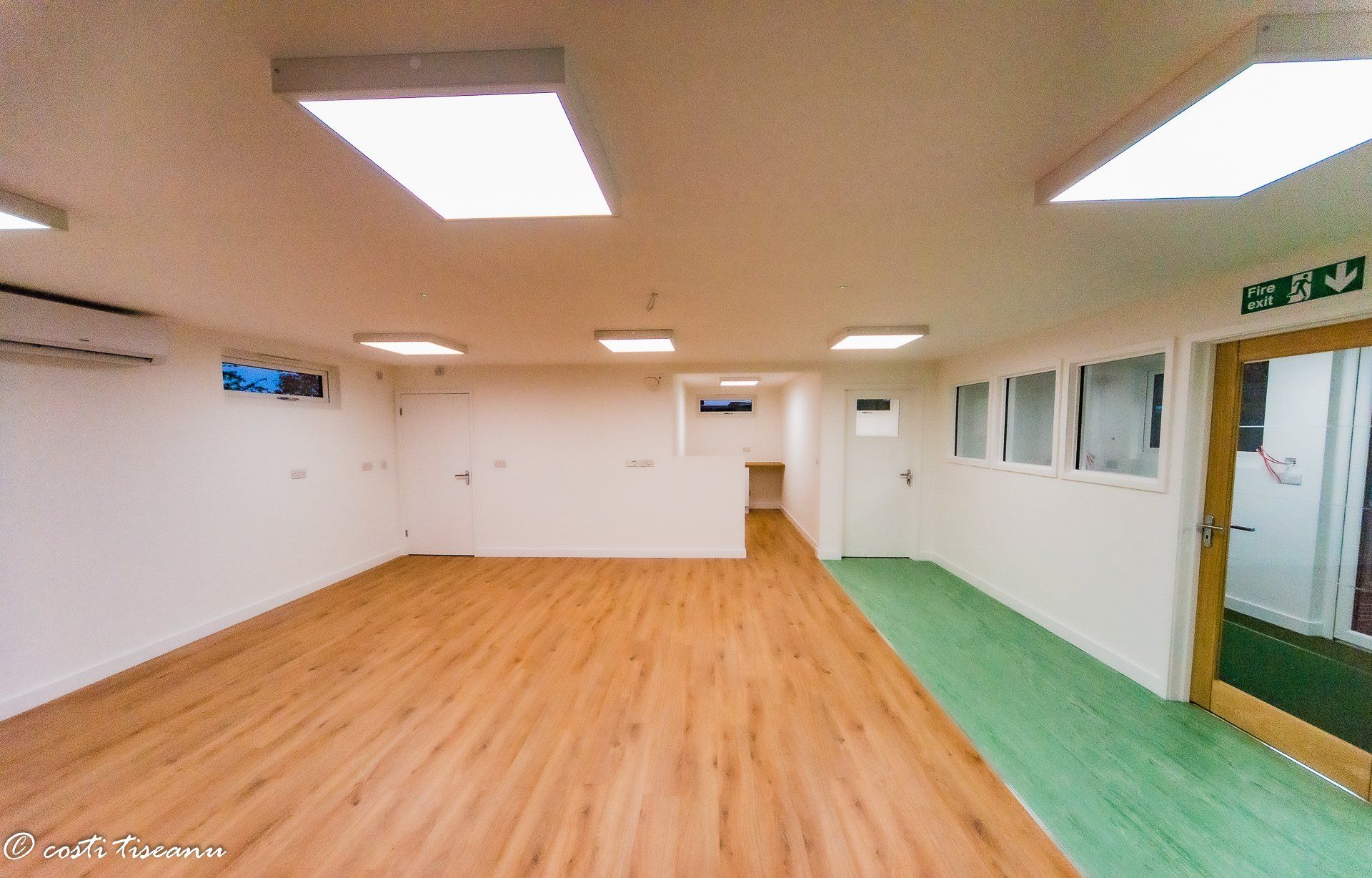 Open classroom interior with rooflights and mixed floor finishes