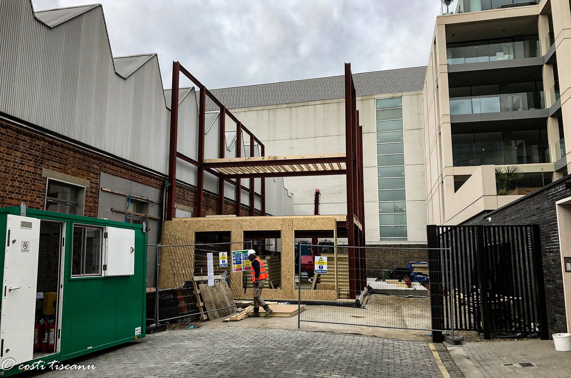 Steel frame during construction between existing buildings