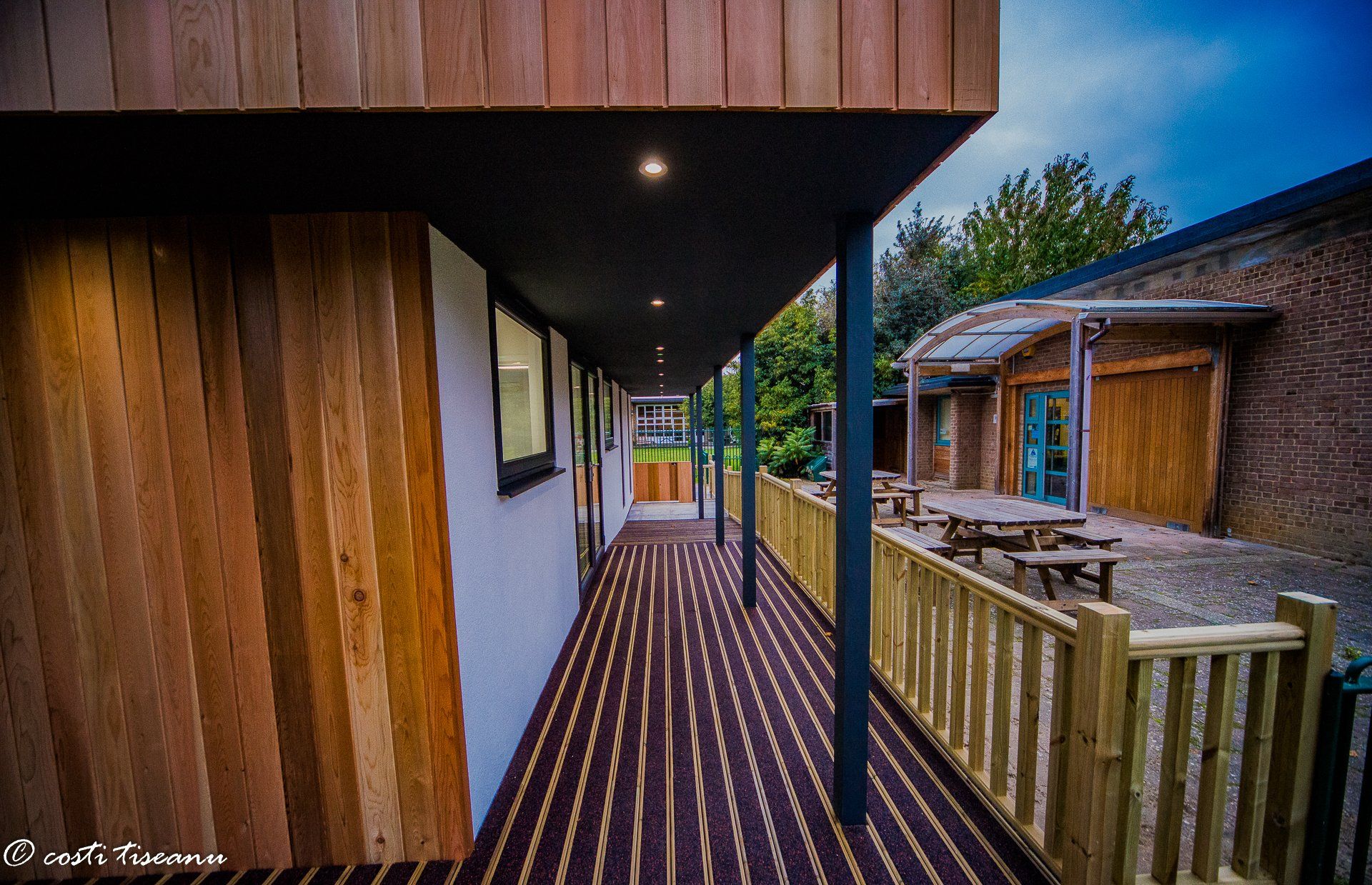 Timber deck and railings along a classroom building