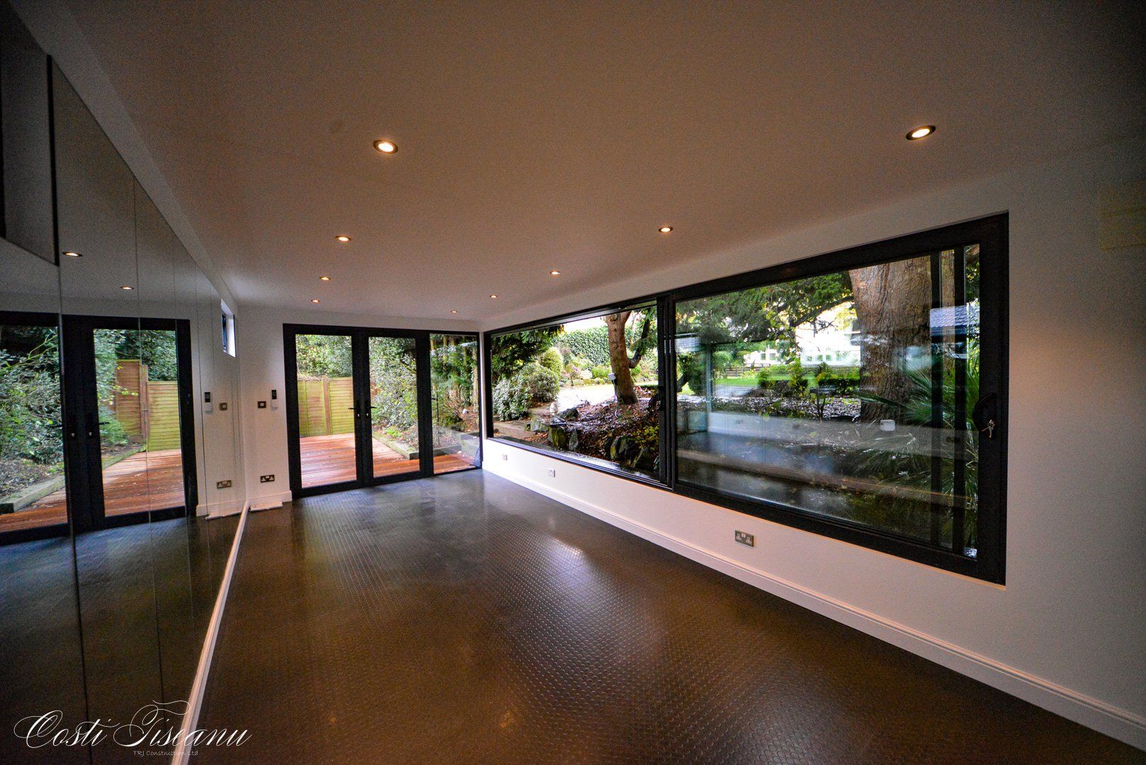 Garden room interior overlooking a leafy garden