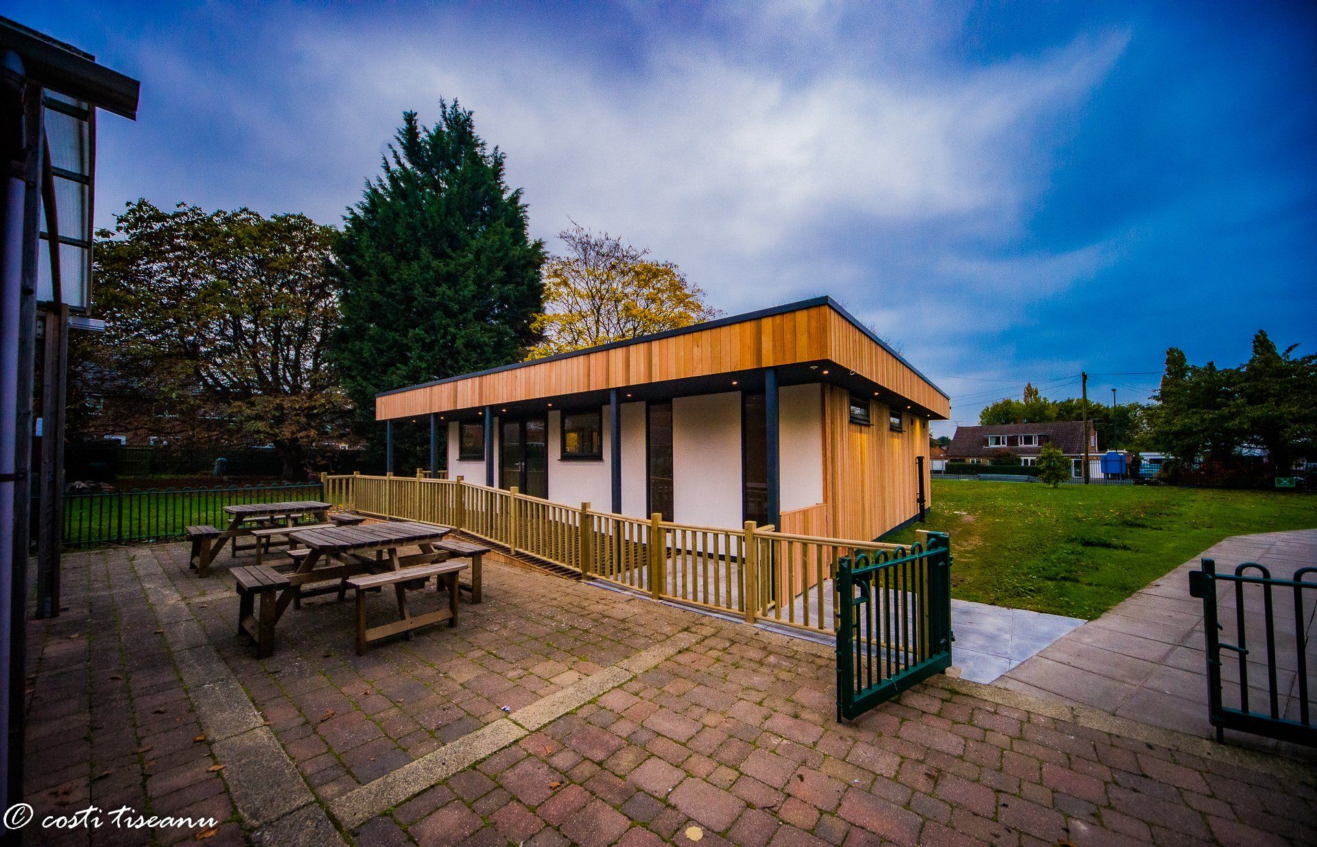 Glazed school building beside a paved playground