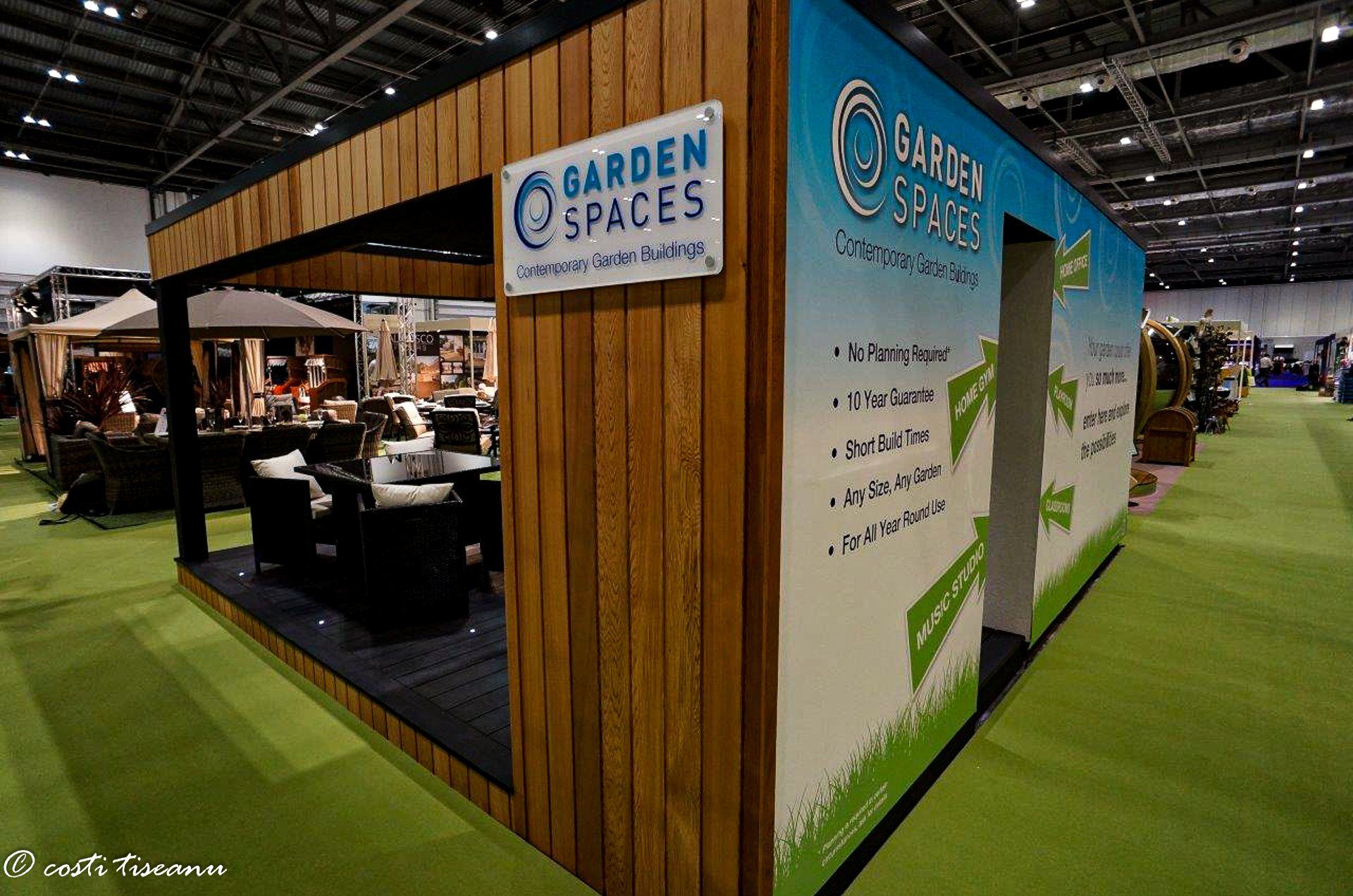 Garden Spaces branding on the timber-clad stand