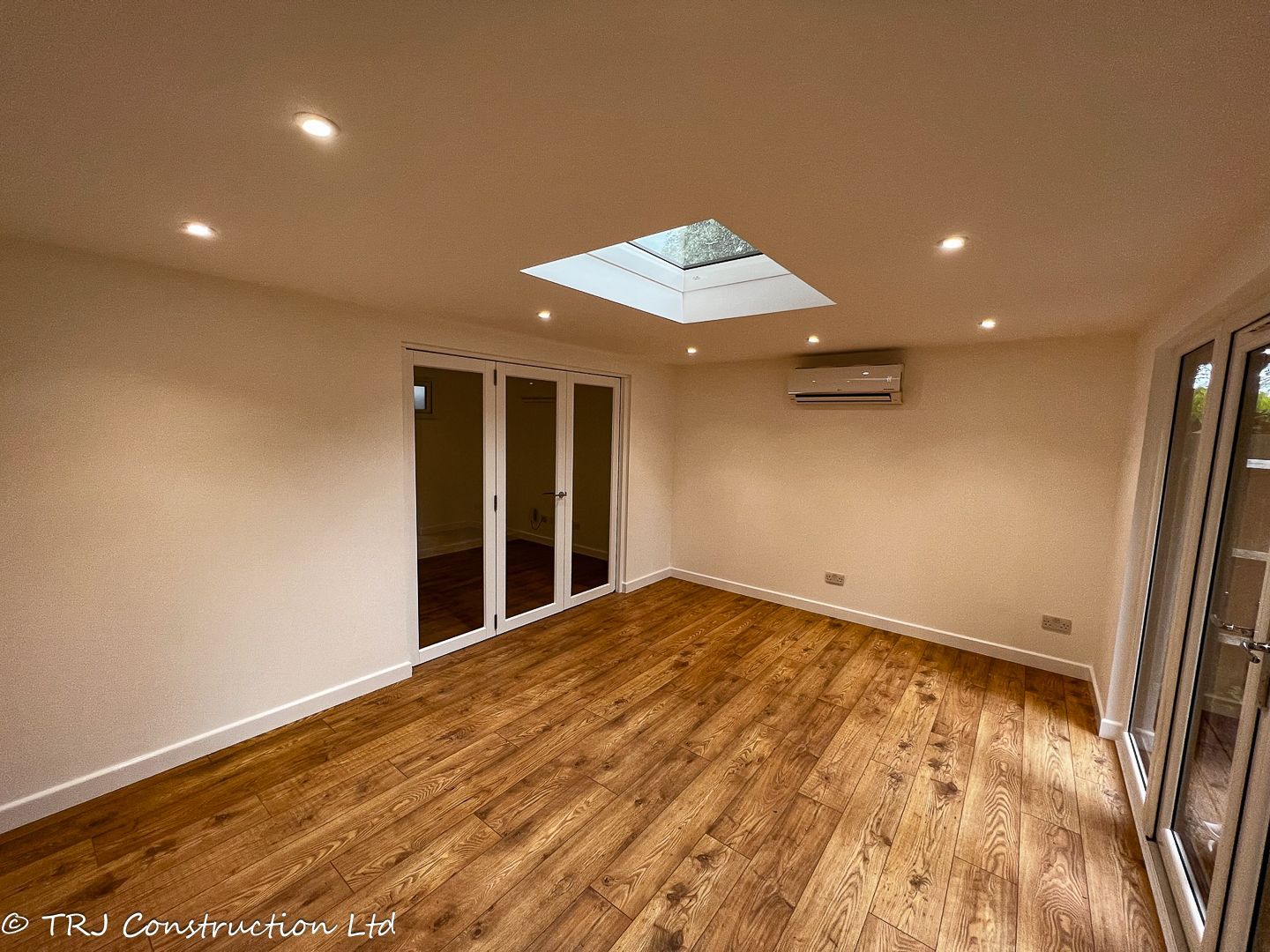 A completed TRJ garden room with wall-mounted air conditioning