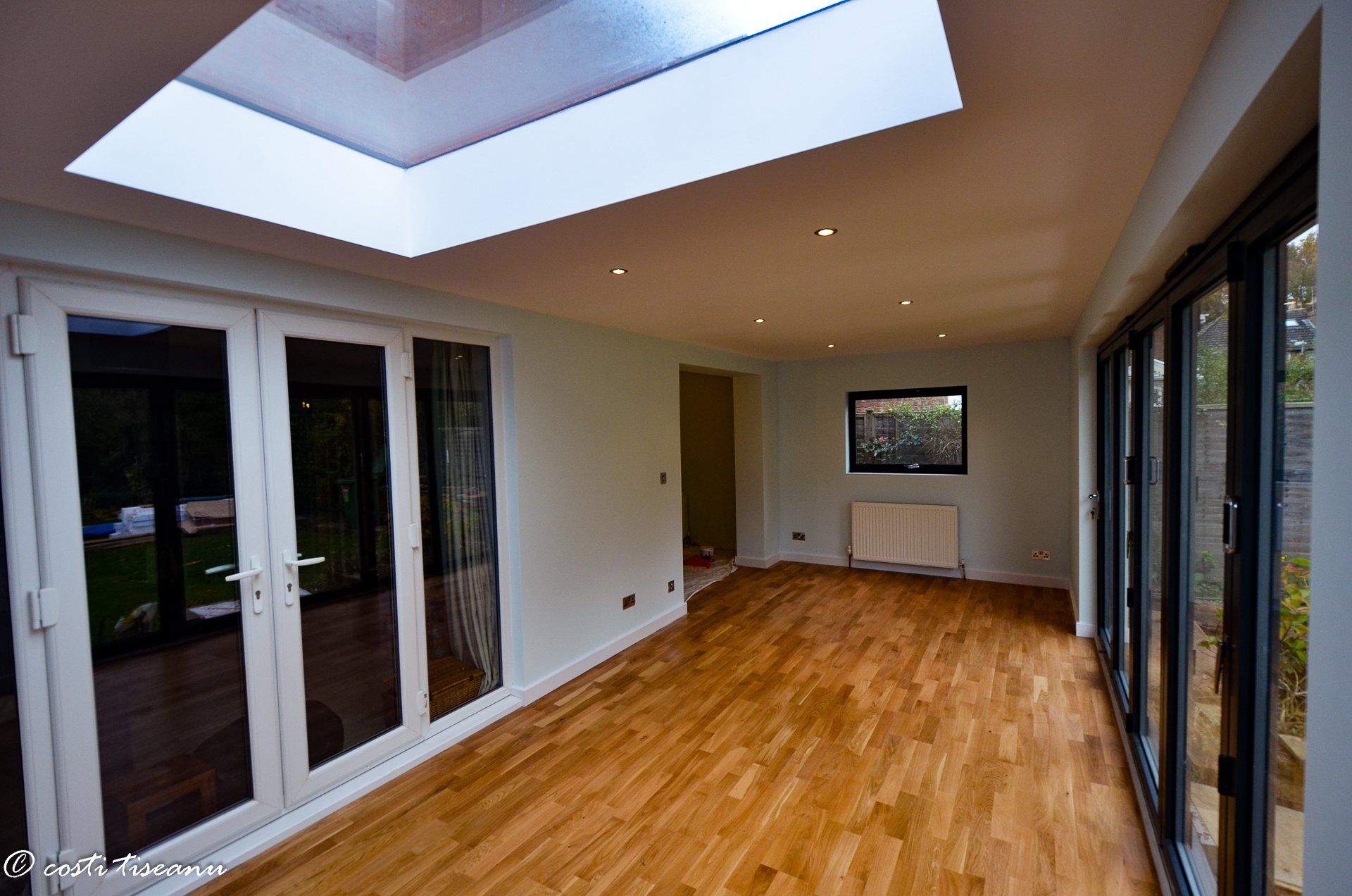Finished extension floor beneath a central rooflight